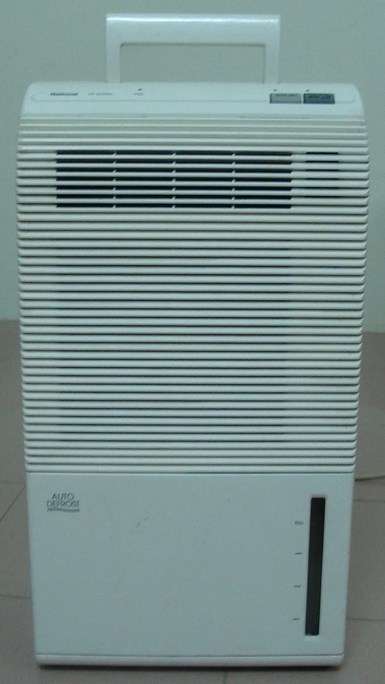 Compact home dehumidifier used to pull moisture from indoor air
