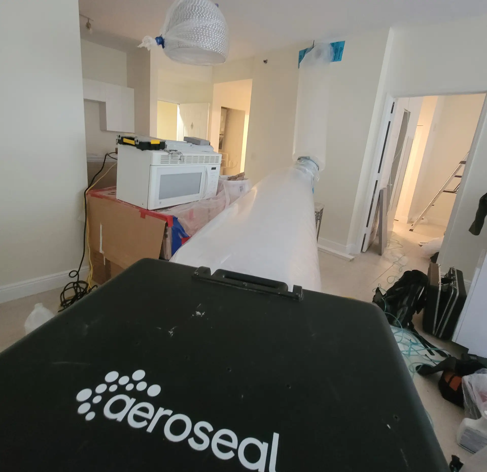 Aeroseal duct sealing process in action - sealing HVAC ducts from the inside in Miami home