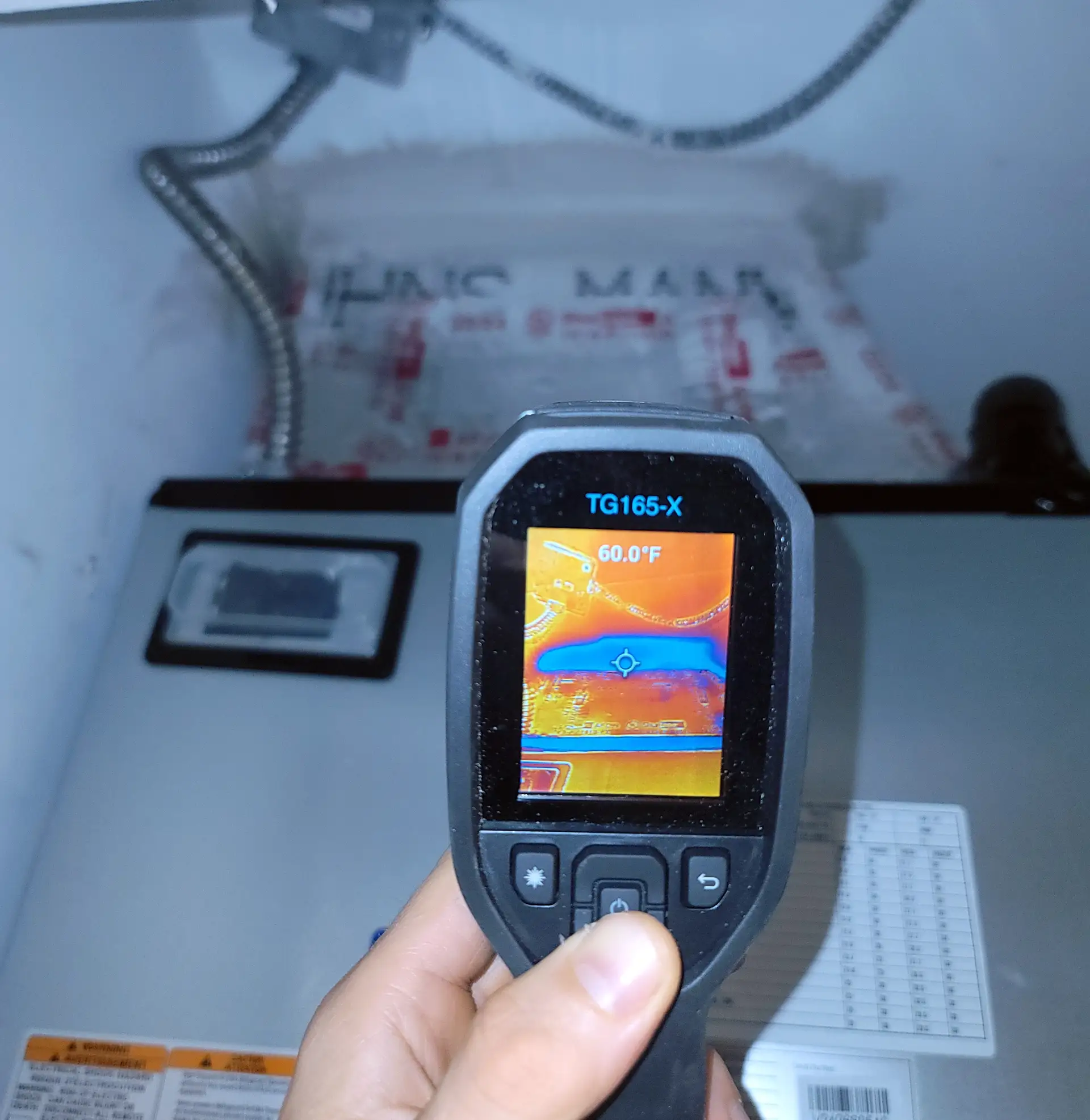 Clean Air Miami technician analyzing HVAC duct system with computer diagnostics in South Florida